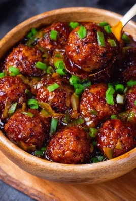 Cabbage Manchurian served in a bowl with garnishes