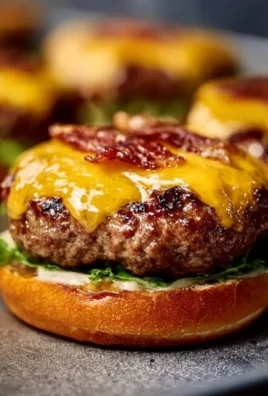 Delicious Crack Burgers on a grill ready to serve