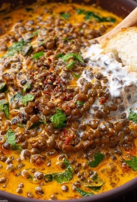 Creamy Marry Me Lentils dish garnished with fresh herbs