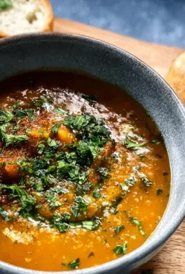 A bowl of Damn Good Vegan Lentil Soup made with fresh ingredients and spices.
