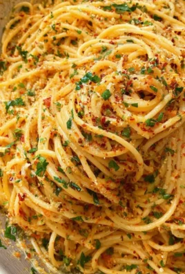 Plate of Garlic Butter Pasta garnished with parsley and grated parmesan