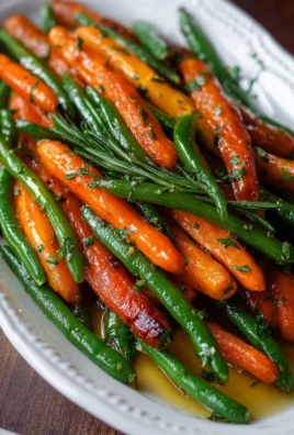 A vibrant dish of honey glazed carrots and green beans, ideal vegetable side.
