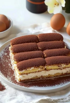 Delicious Italian tiramisu dessert with layers of coffee-soaked ladyfingers and creamy mascarpone.