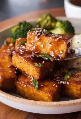 Plate of maple glazed tofu garnished with vegetables