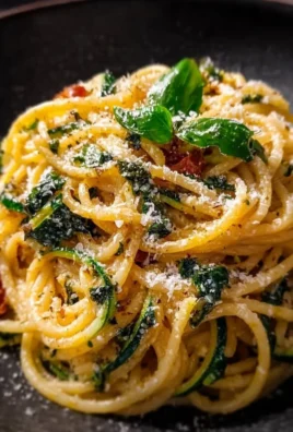 Delicious plate of Nerano Spaghetti topped with cheese and zucchini