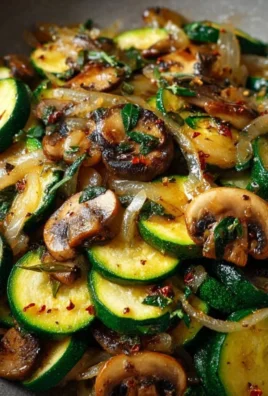 Delicious sautéed zucchini with mushrooms and onions served as a healthy dish