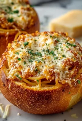 Spaghetti garlic bread bowls filled with savory pasta and garlic bread crust