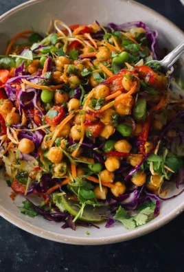 Thai-inspired chickpea salad with fresh vegetables and herbs