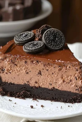 Triple Chocolate Cheesecake with Oreo Crust topped with whipped cream