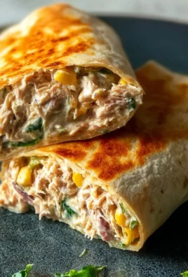 Delicious tuna melt wrap filled with fresh ingredients and melted cheese