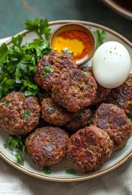 Plate of delicious Turkish Meatballs with herbs and spices served with sauce