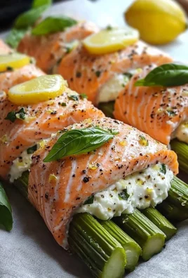 Asparagus and Lemon Basil Ricotta Stuffed Salmon Rolls served on a plate