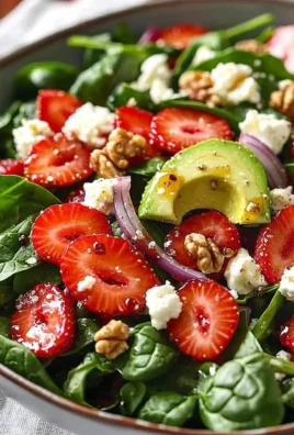 Delicious strawberry spinach salad with fresh strawberries and greens
