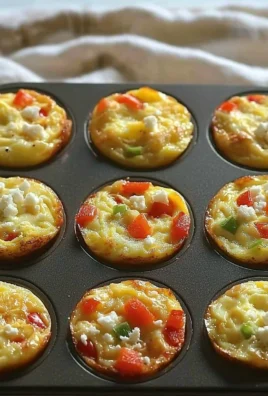 Delicious homemade breakfast egg muffins filled with vegetables and cheese.