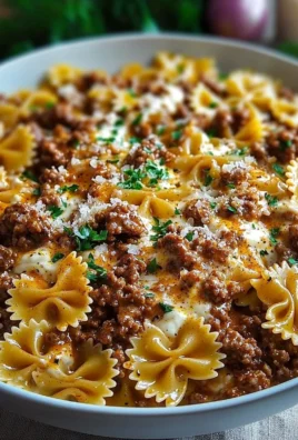 Cajun Cream Cheese Alfredo Bowties topped with spiced ground beef