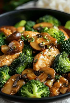 Healthy Chicken, Broccoli & Mushroom Stir-Fry dish served in a vibrant bowl.