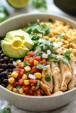 Delicious chicken burrito bowl topped with fresh vegetables and sauces