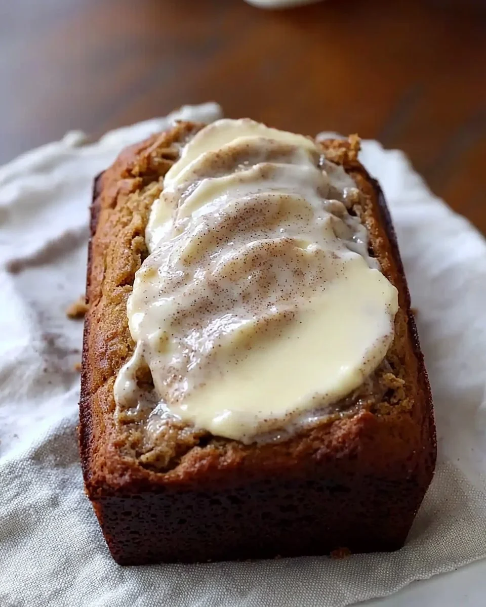 Delicious cinnamon roll banana bread with cinnamon swirl topping