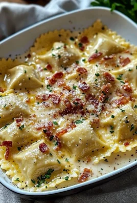 Plate of creamy Carbonara Ravioli topped with cheese and herbs