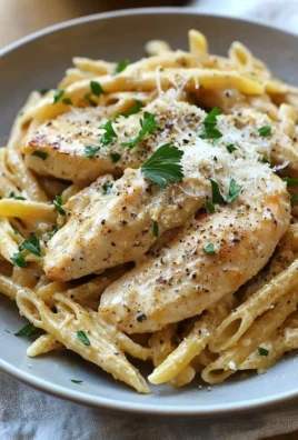 Garlic Parmesan Chicken served with pasta in a creamy sauce