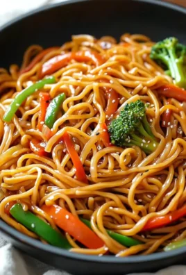 Delicious plate of Lo Mein noodles with vegetables and sauce