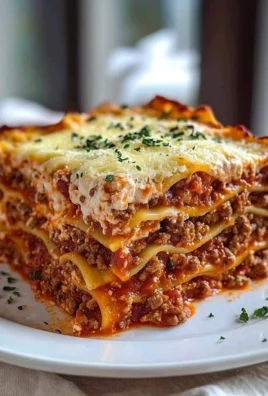 Delicious quick and easy lasagna served with fresh herbs and cheese on top.