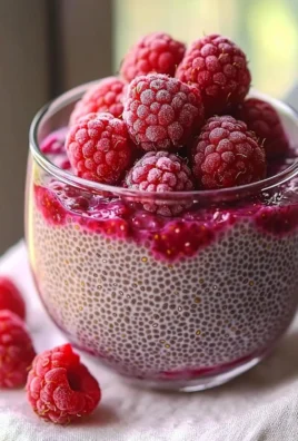 Delicious Raspberry Chia Pudding topped with fresh raspberries and coconut