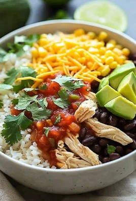 Delicious Slow Cooker Chicken Burrito Bowl topped with fresh ingredients