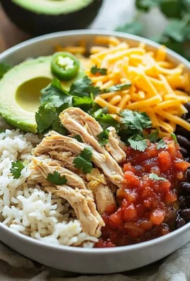Delicious slow cooker chicken burrito bowl topped with fresh ingredients.