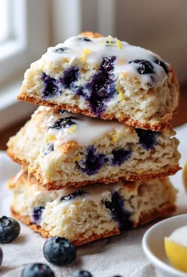 Delicious blueberry lemon scones on a baking tray, freshly made.