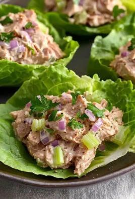 Tuna lettuce wraps filled with fresh ingredients and served on a plate