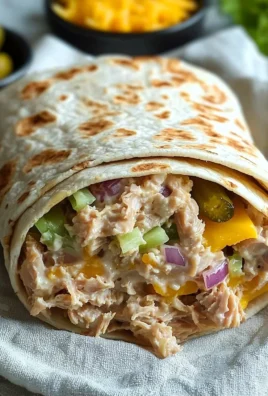 Tuna Melt Wrap featuring melted cheese and flavorful tuna in a soft wrap