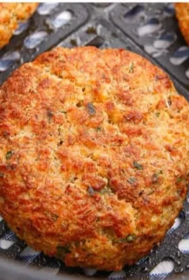 Crispy air fryer salmon patties served with a side salad