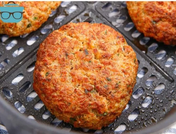 Crispy air fryer salmon patties served with a side salad
