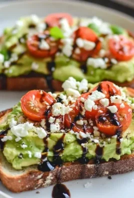 Avocado toast with feta cheese and cherry tomatoes on a rustic wooden table