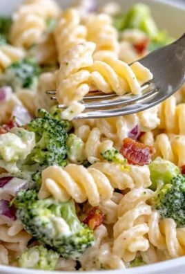 Delicious broccoli pasta salad with fresh vegetables and dressing