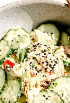 Colorful California Roll Cucumber Salad with crab, avocado, and cucumber slices.