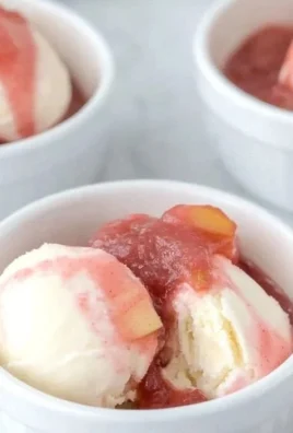 Bowl of fresh rhubarb sauce served over ice cream
