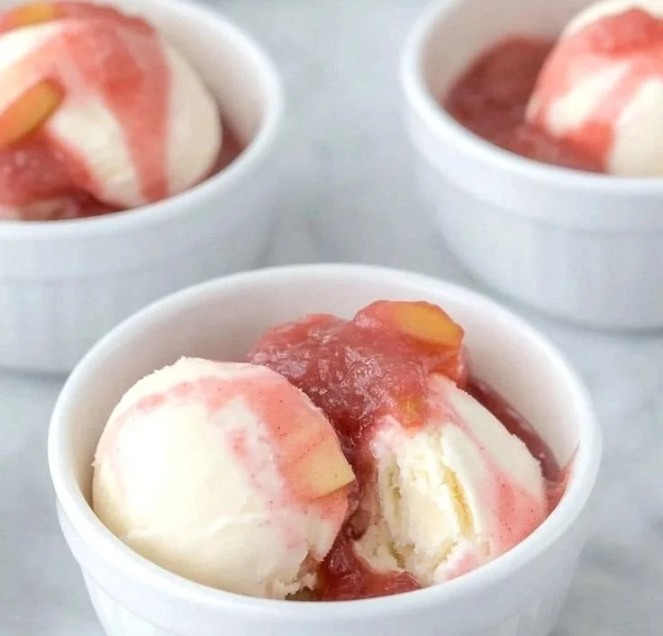 Bowl of fresh rhubarb sauce served over ice cream