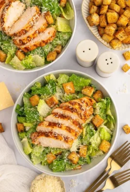 A fresh Grilled Chicken Caesar Salad with grilled chicken, romaine lettuce, and Caesar dressing.