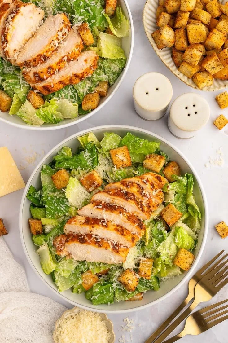 A fresh Grilled Chicken Caesar Salad with grilled chicken, romaine lettuce, and Caesar dressing.