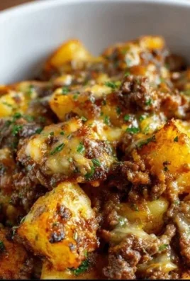 A plate of homemade hamburger hash with beef, potatoes, and vegetables