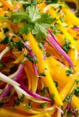 Colorful mango slaw served in a bowl with fresh ingredients.