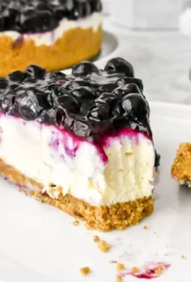 Delicious no bake blueberry cheesecake topped with fresh blueberries and whipped cream