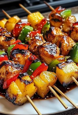 Delicious grilled pineapple chicken kabobs skewered with vibrant vegetables