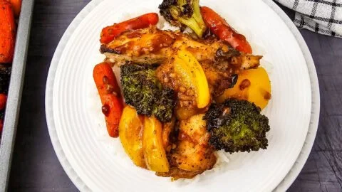 Sheet pan honey garlic chicken with mixed vegetables ready to be served