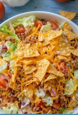 Delicious and colorful Doritos Taco Salad with fresh vegetables and toppings