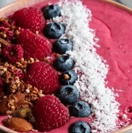 Colorful smoothie bowl topped with fruits and nuts, showcasing the 5 ingredient principle