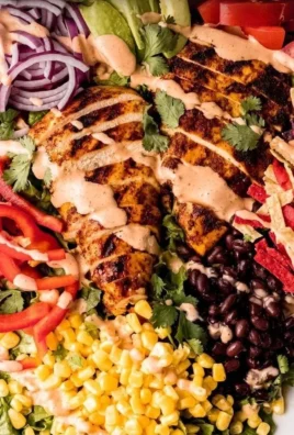 Bowl of Spicy Southwest Avocado Chicken Salad with fresh ingredients.