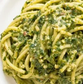 Delicious plate of arugula pasta with fresh ingredients